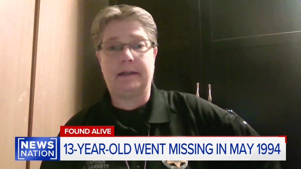 A woman in glasses and uniform speaking, with a news chyron below reading "FOUND ALIVE" and "13-YEAR-OLD WENT MISSING IN MAY 1994".