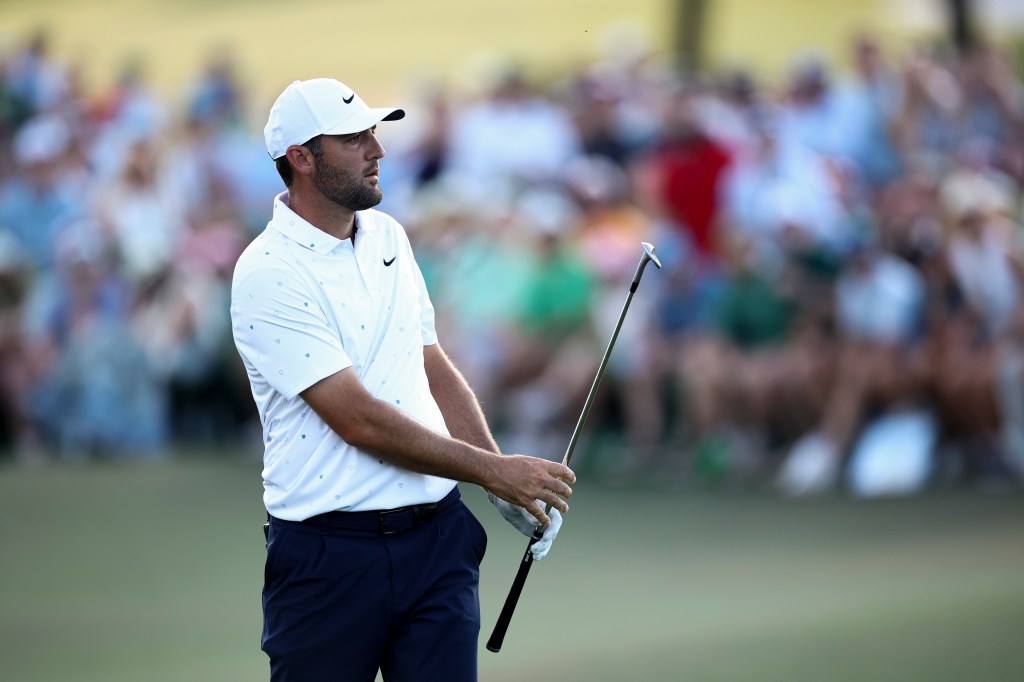 Scottie Scheffler on the 18th green during the final round of the Masters Tournament.