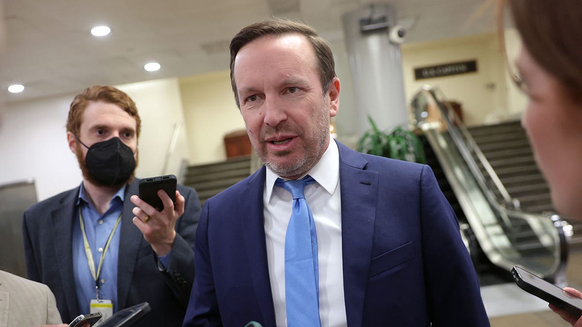 Sen. Chris Murphy speaking to reporters outside his office at the U.S. Capitol