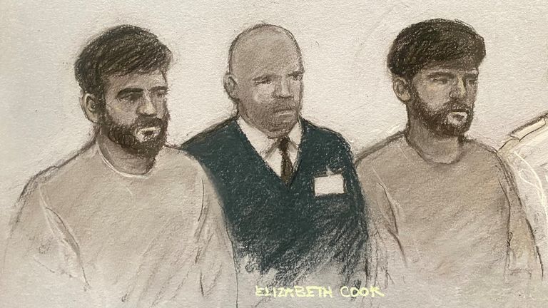 Court artist sketch by Elizabeth Cook of Hamza Iqbal (left), 20, Rehan Khan (right), 19, alongside a dock officer, appearing at Westminster