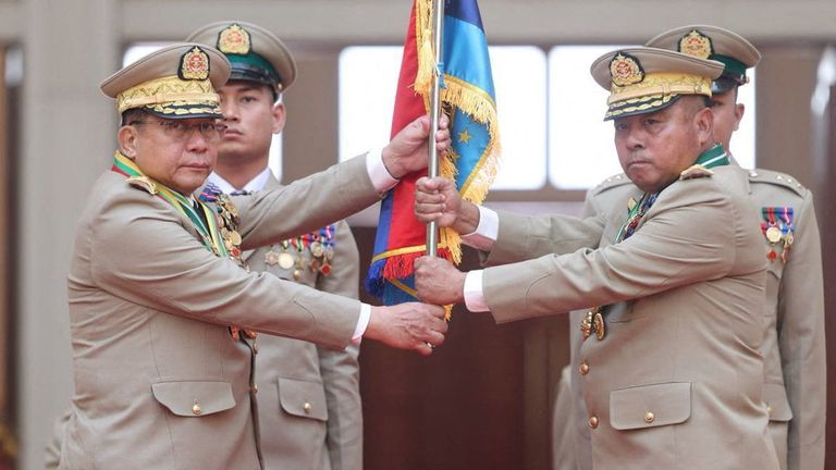 General Min Aung Hlaing (L) handing a flag to newly appointed Commander-in-Chief General Ye Win Oo. Pic: Reuters
