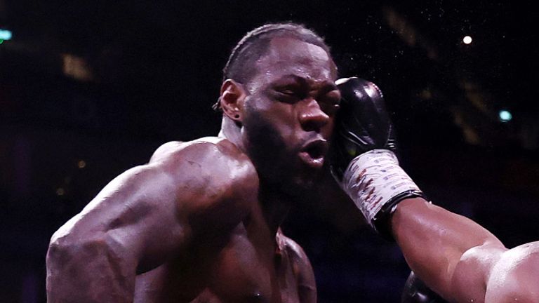 Derek Chisora lands a shot to the face of Deontay Wilder