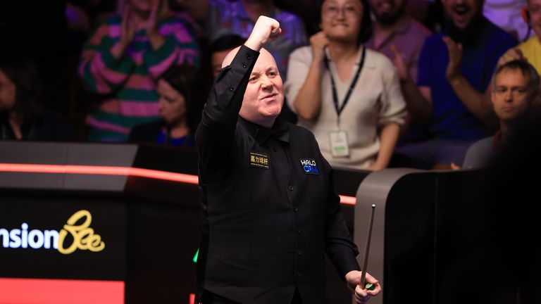 Higgins celebrates beating O'Sullivan