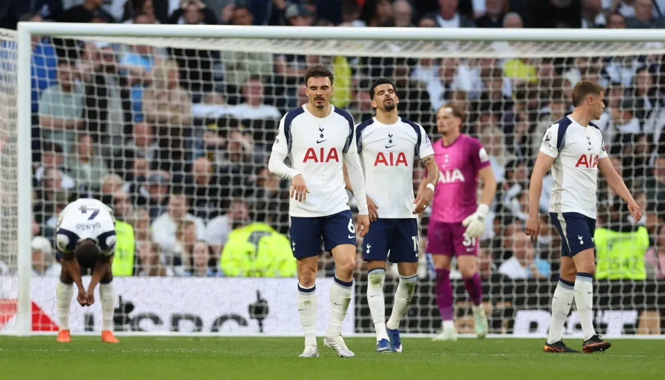 Tottenham Hotspur players react after conceding to Brighton