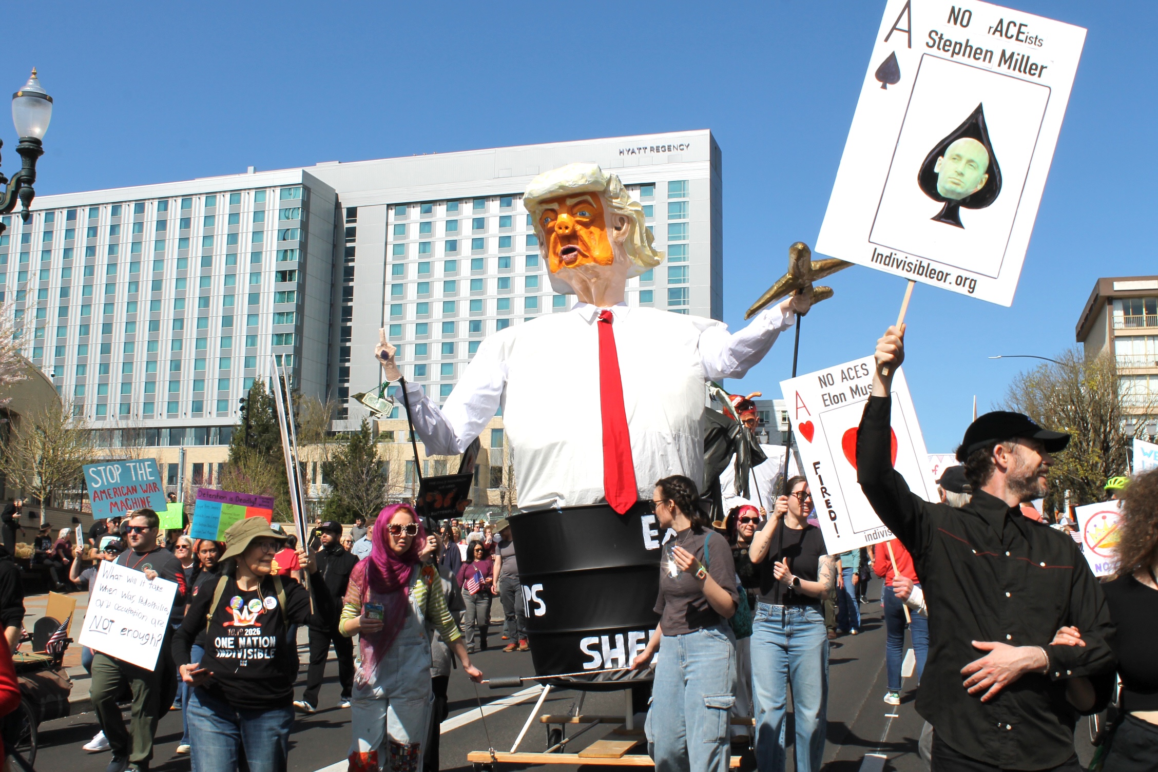 Portlanders at No Kings 3 protest the war in Iran with an effigy of the president standing inside an oil barrel.