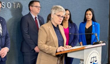 Minnesota charges federal officer with assault for pointing gun at vehicle during immigration surge : NPR