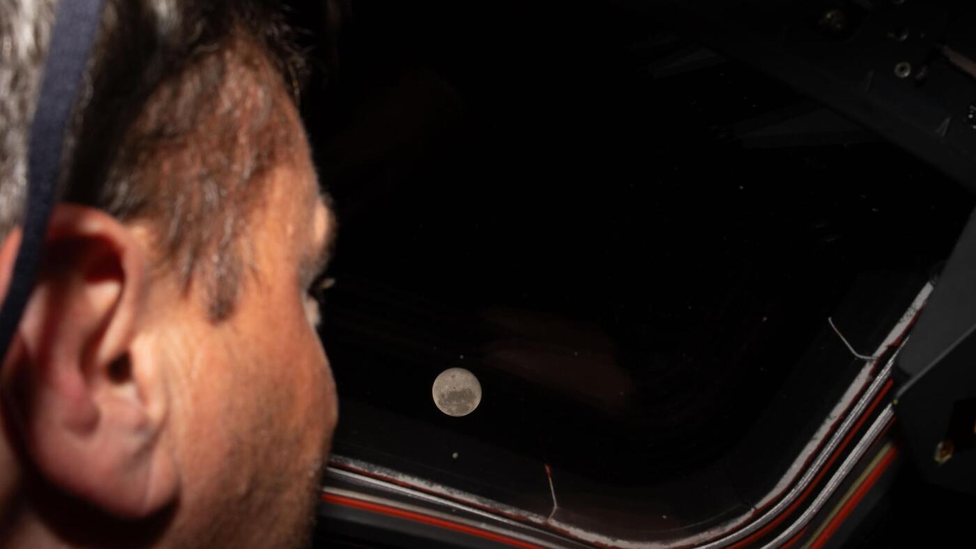 Artemis II astronauts swung by the moon, broke an Apollo record, and saw an eclipse : NPR