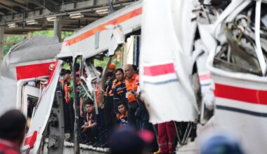 Rescuers recover victims from an Indonesia train crash, in photos