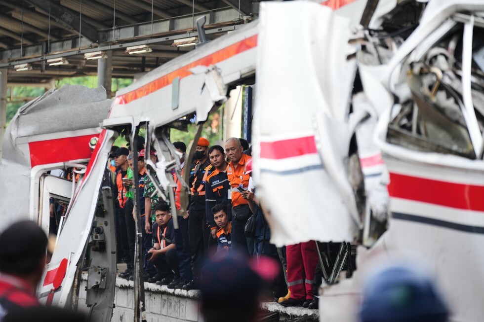 Rescuers recover victims from an Indonesia train crash, in photos