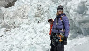 climbers with icefall background