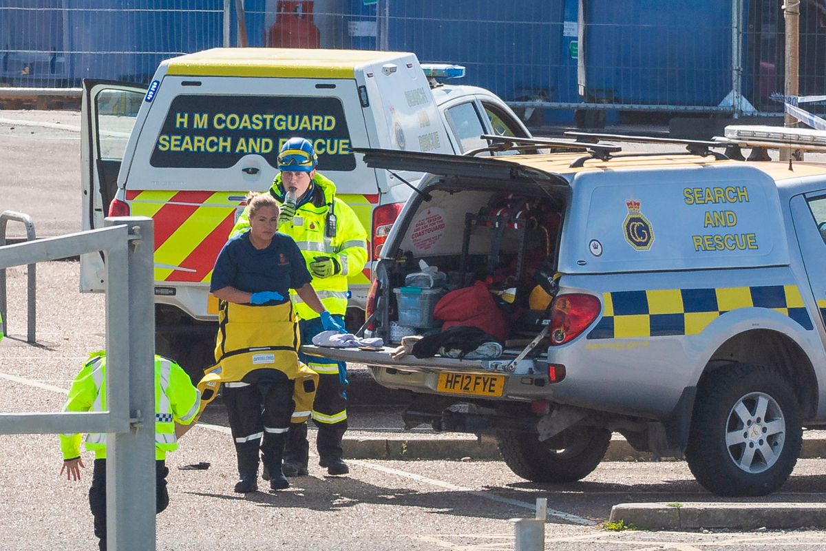 Coastguard officers and Police on Brighton beach after the three sisters' deaths were confirmed