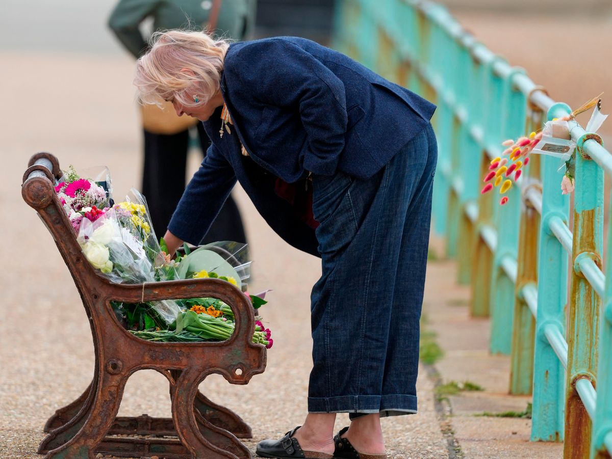 Wellwishers left flowers clsoe to the spot where the three women were found in tribute to them