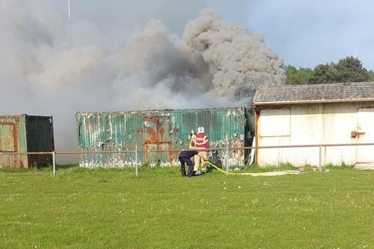 Storage container fire on field
