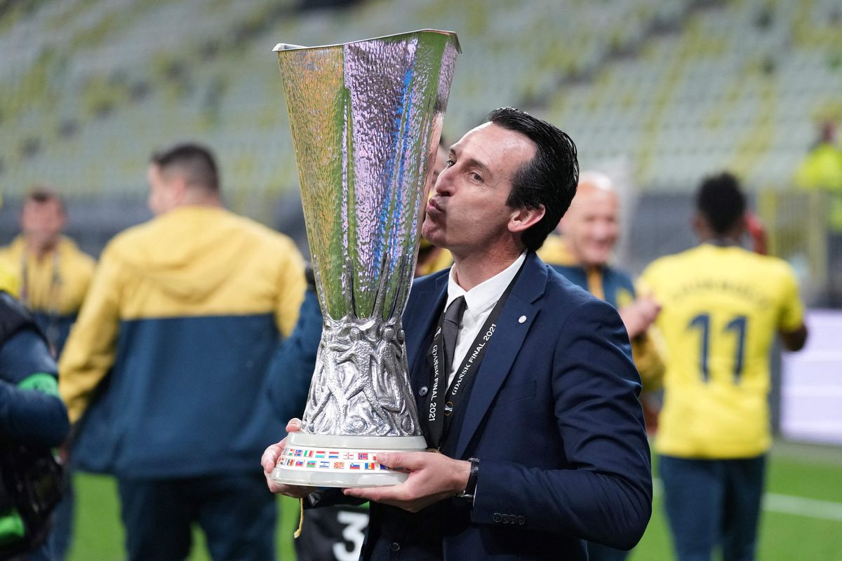 Unai Emery poses for pictures with the trophy after winning the UEFA Europa League final football