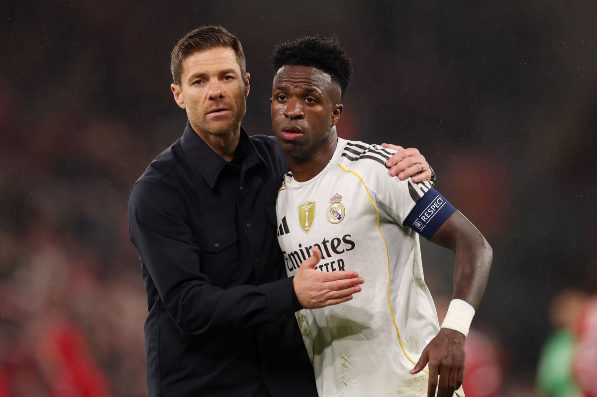 Xabi Alonso, Head Coach of Real Madrid, consoles Vinicius Junior of Real Madrid after the team's defeat in the UEFA Champions League 2025/26 League Phase MD4 match between Liverpool FC and Real Madrid C.F. at Anfield on November 04, 2025 in Liverpool, England