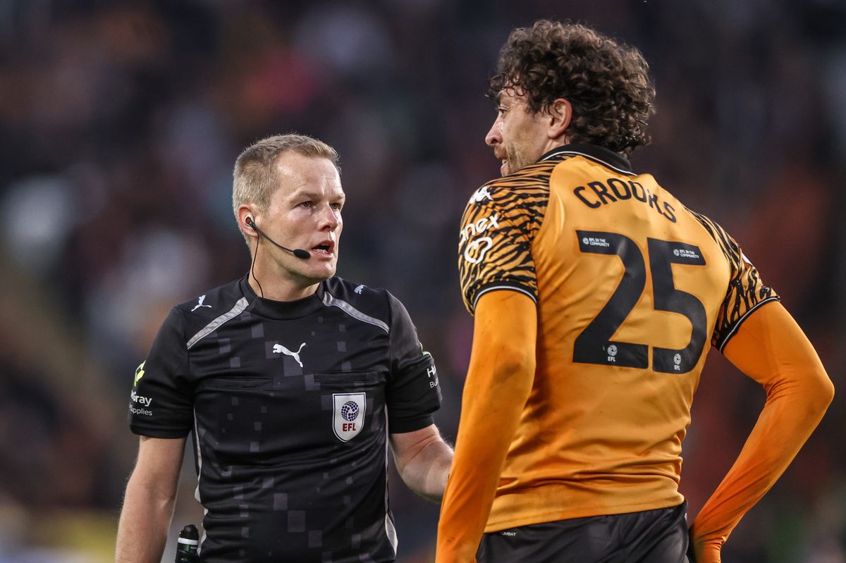 Referee Gavin Ward speaks to Matt Crooks during the play-off semi-final against Millwall