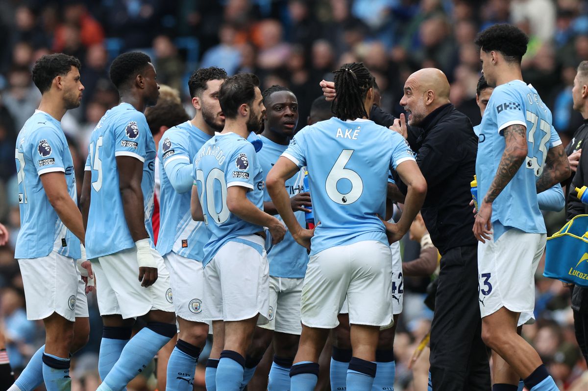 Pep Guardiola and Manchester City are still chasing Arsenal in the title race