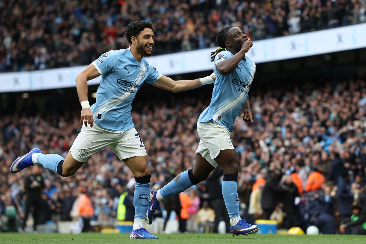 Jeremy Doku celebrates after scoring for Manchester City