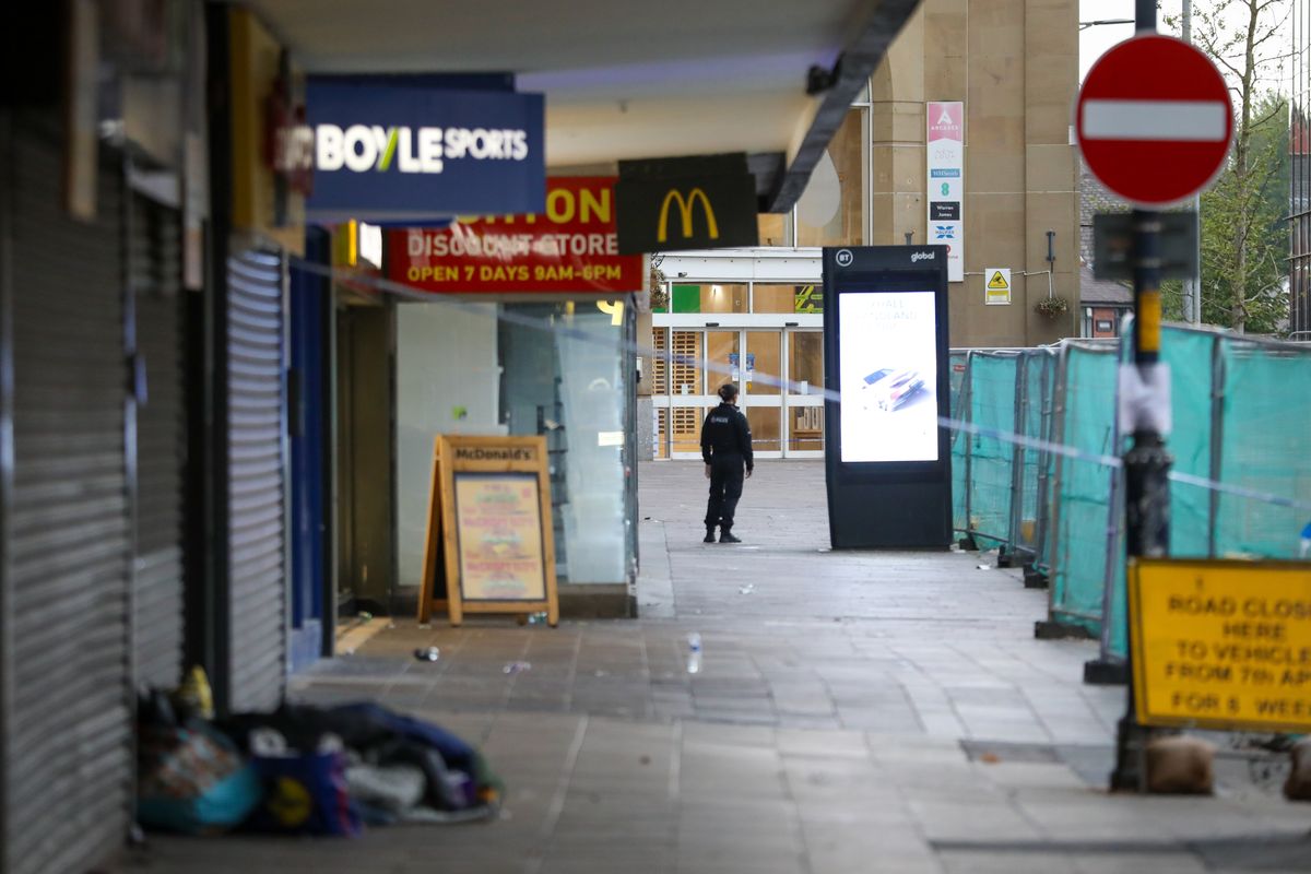 Police scene in Ashton town centre after suspected acid attack. Credit: ASP