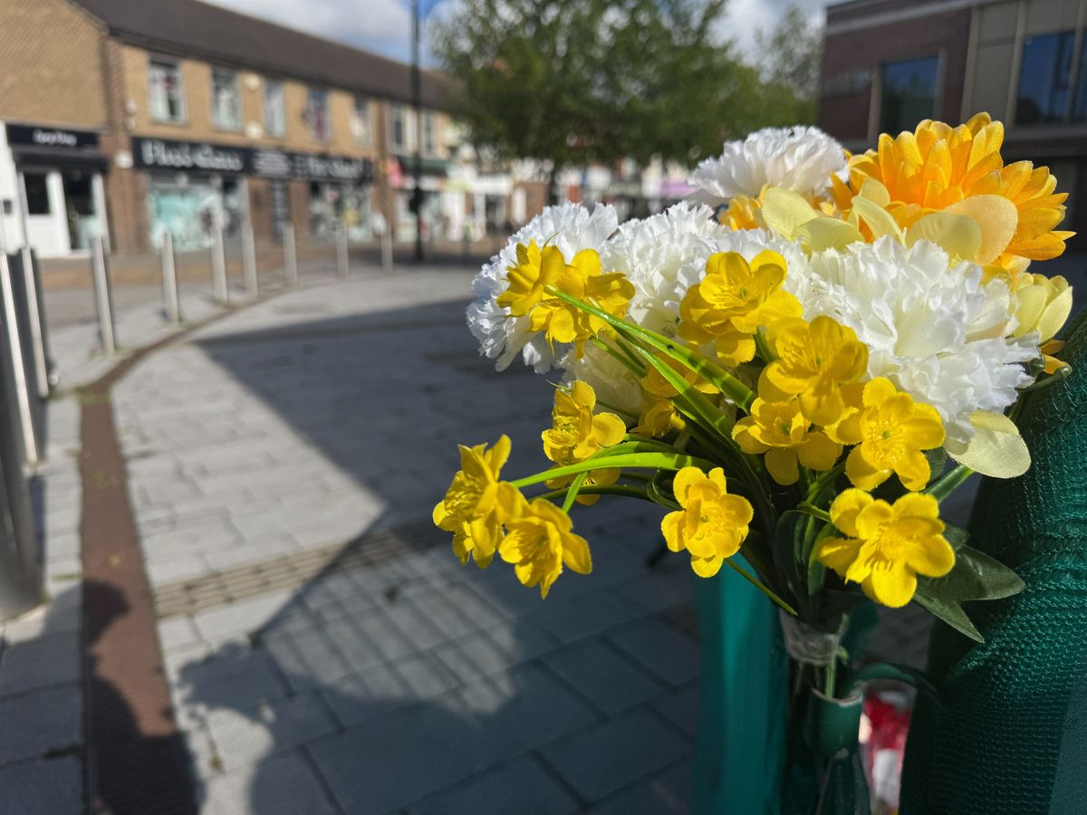 Some of the flowers left at the scene
