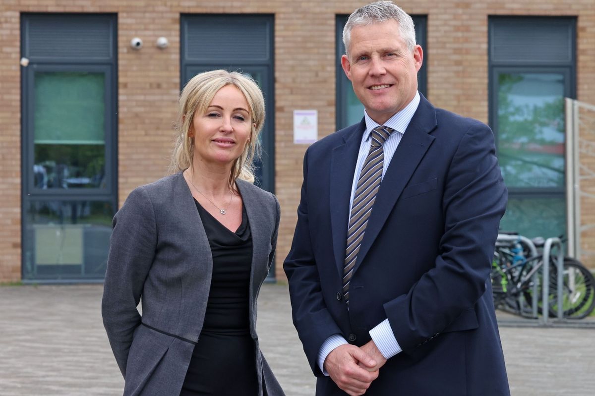 Paul Stirling and Emma Griffiths outside Archbishop Beck Catholic College