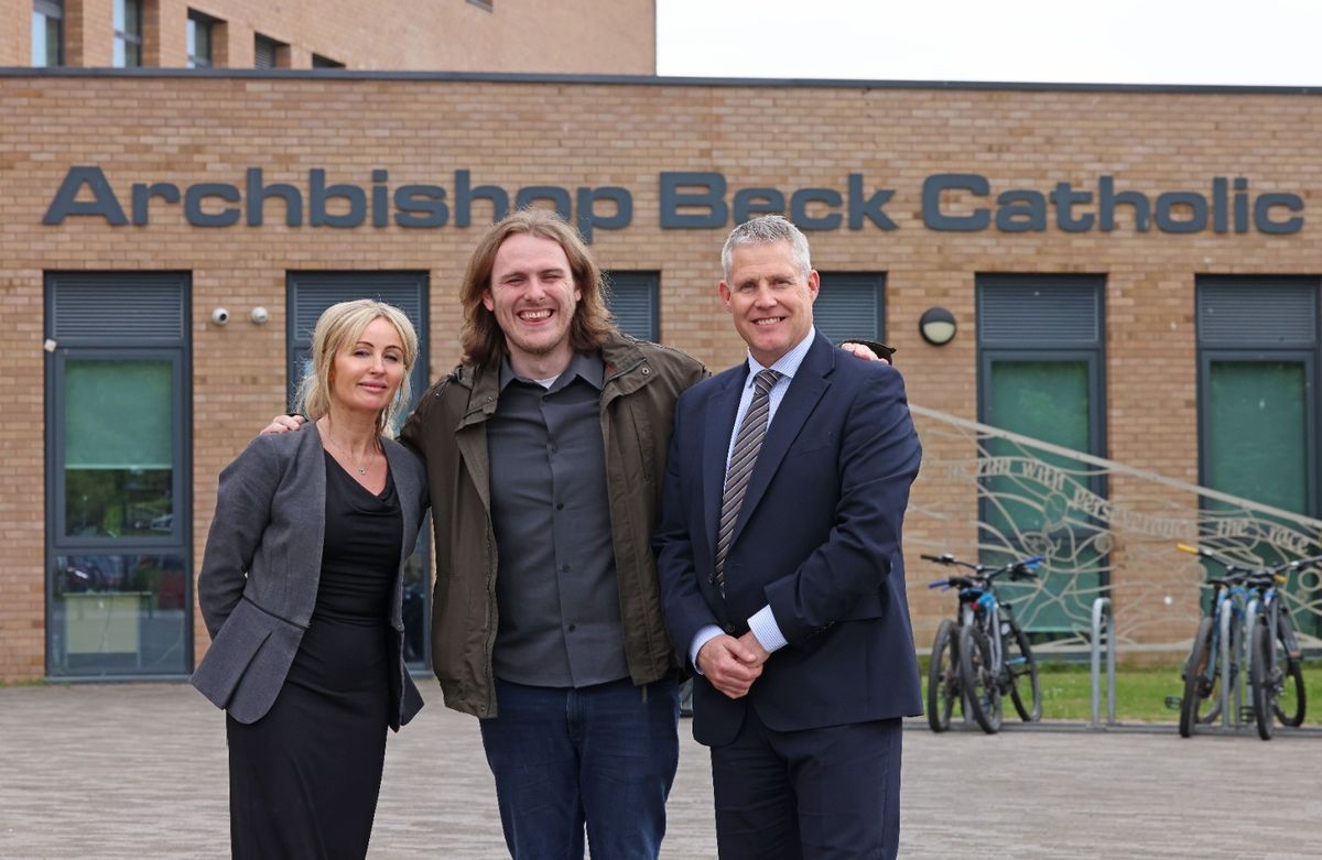 Paul Stirling and Emma Griffiths with Ryan Paton outside Archbishop Beck Catholic College