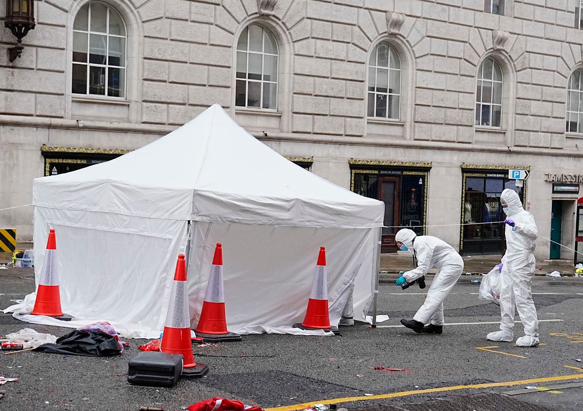 Forensic officers at the scene in Water. Street, Liverpool after Doyle struck