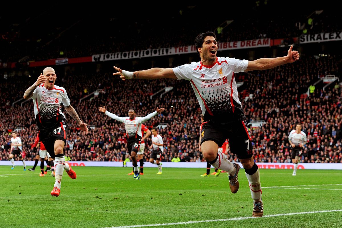 Luis Suarez celebrates after scoring the third goal during the Barclays Premier League match between Manchester United and Liverpool at Old Trafford.