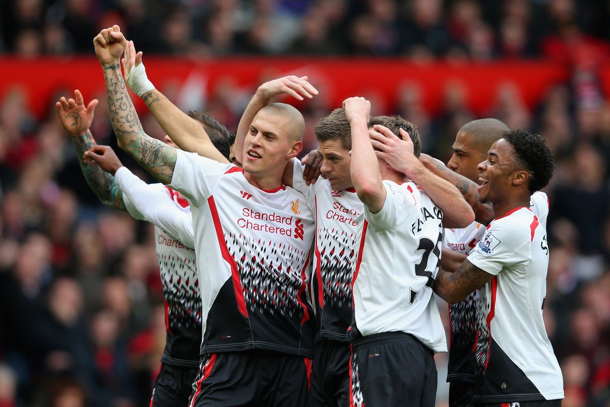 Steven Gerrard celebrates scoring the first goal with his team-mates during the Barclays Premier League match between Manchester United and Liverpool.