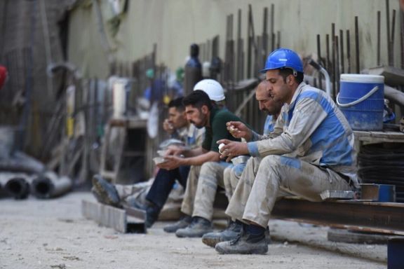 File photo: Construction workers take a break at a site in Iran