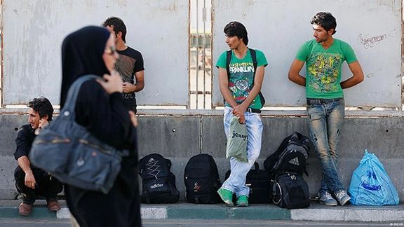 File photo: Seasonal workers wait for daily jobs in Tehran