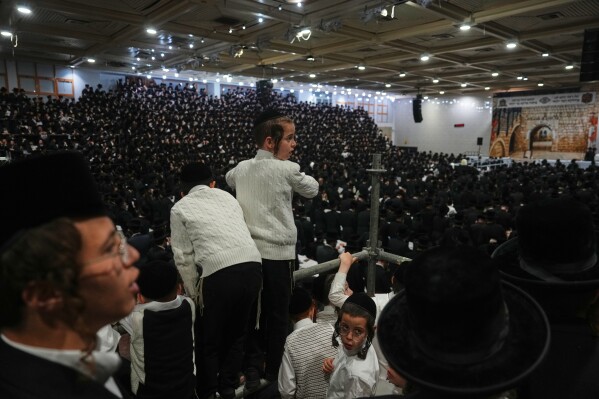Ultra-Orthodox Jews celebrate the holiday of Lag BaOmer, traditionally marked by bonfire, music, and communal celebrations, in Netanya, Israel, Monday, May 4, 2026. (AP Photo/Ariel Schalit)