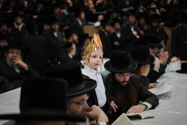 Ultra-Orthodox Jews celebrate the holiday of Lag BaOmer, traditionally marked by bonfire, music, and communal celebrations, in Netanya, Israel, Monday, May 4, 2026. (AP Photo/Ariel Schalit)