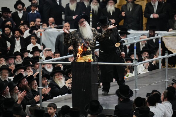Ultra-Orthodox Jews celebrate the holiday of Lag BaOmer, traditionally marked by bonfire, music, and communal celebrations, in Netanya, Israel, Monday, May 4, 2026. (AP Photo/Ariel Schalit)