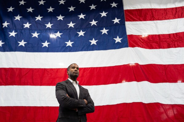 Rep. John James, R-Mich., listens to U.S. Trade Representative Jamieson Greer, not pictured, speak during a tour of Atomic Industries' manufacturing facility, Thursday, April 9, 2026, in Warren, Mich. (AP Photo/Julia Demaree Nikhinson)