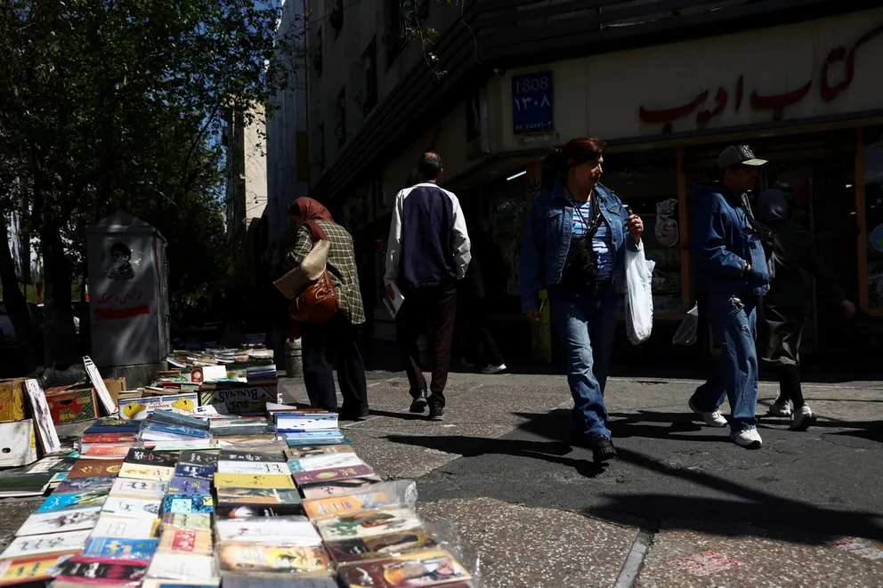 People walk on a street after US President Donald Trump said that he had agreed to a two-week ceasefire with Iran, in Tehran, Iran, April 8, 2026.
