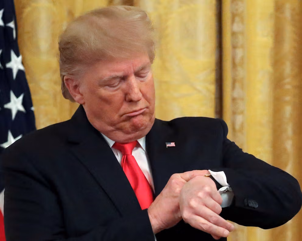 US President Donald Trump checks his watch during an event in the White House in Washington, DC, US, November 6, 2019.