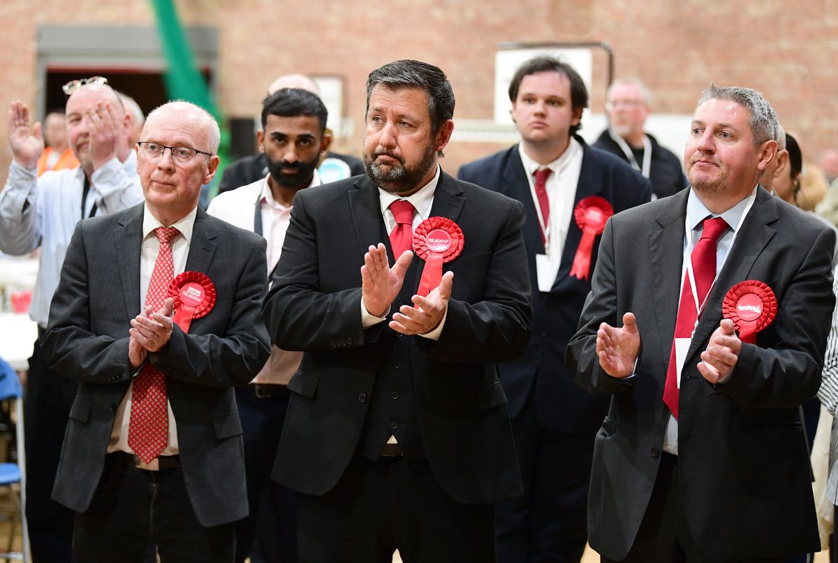 Labour's Anthony Burns(centre),Leader of St Helens Council loses his seat.