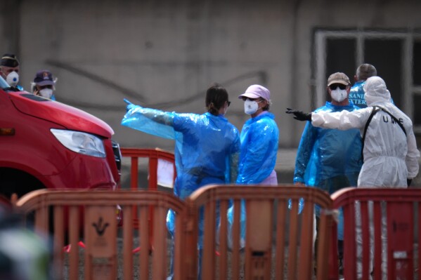 Passengers are disembarked from the hantavirus-stricken cruise ship MV Hondius at the port of Granadilla in Tenerife, Canary Islands, Spain, Sunday, May 10, 2026. (AP Photo/Manu Fernandez)