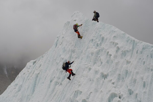 Mountaineers participate in a training session at the Khumbu Icefall as they prepare for their ascent to the summit of Mount Everest, Nepal, Saturday, May 2, 2026. (AP Photo/Pasang Rinzee Sherpa)