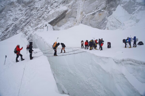 Mountaineers participate in a training session at the Khumbu Icefall as they prepare for their ascent to the summit of Mount Everest, Nepal, Saturday, May 9, 2026. (AP Photo/Pasang Rinzee Sherpa)