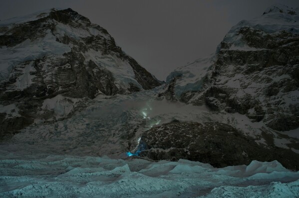 A trail of mountaineers' headlamps is visible from Everest Base Camp as climbers ascend toward the summit of Mount Everest, Nepal, Thursday, April 30, 2026. (AP Photo/Pasang Rinzee Sherpa)