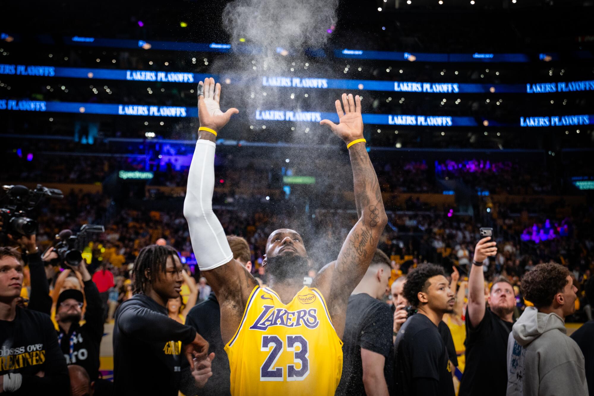 LeBron James does his pregame powder toss before Game 1 of the Lakers' first-round playoff series.