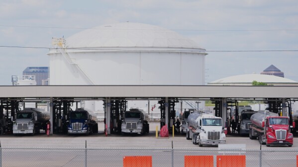 Gas tankers fill up at a fuel terminal in Irving, Texas, Monday, May 11, 2026. (AP Photo/LM Otero)