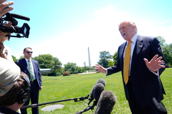 President Donald Trump speaks to reporters as he leaves the White House for travel to Beijing, Tuesday, May 12, 2026, in Washington, to meet with China's President Xi Jinping. (AP Photo/Manuel Balce Ceneta)