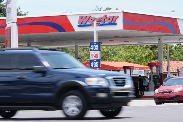 Gas prices are displayed at a Westar gas station in Miami, Tuesday, May 12, 2026. (AP Photo/Marta Lavandier)