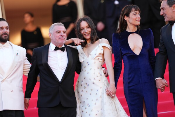 Pio Marmaï, from left, director Pierre Salvadori, Anaïs Demoustier, Vimala Pons and Gilles Lellouche pose for photographers at the opening ceremony and premiere of the film 'The Electric Kiss' during 79th international film festival, Cannes, southern France, Tuesday, May 12, 2026. (Photo by Scott A Garfitt/Invision/AP)