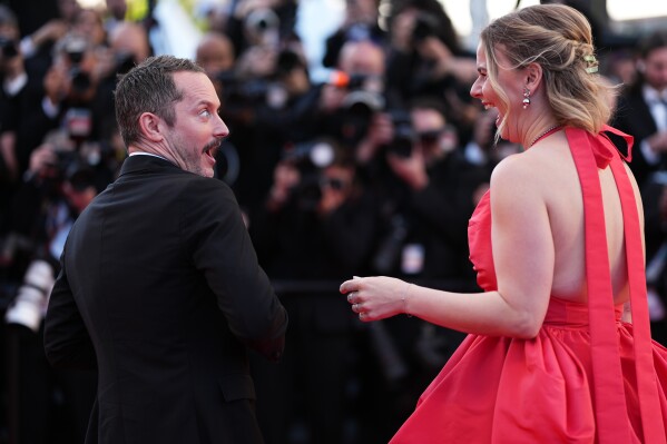 Elijah Wood, left, and Mette-Marie Kongsved pose for photographers at the opening ceremony and premiere of the film 'The Electric Kiss' during 79th international film festival, Cannes, southern France, Tuesday, May 12, 2026. (Photo by Scott A Garfitt/Invision/AP)