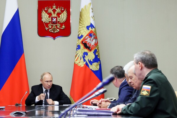 Russian President Vladimir Putin, left, leads a meeting with top security and defense officials at the Novo-Ogaryovo state residence outside of Moscow, Aug. 12, 2024. (Gavriil Grigorov, Sputnik, Kremlin Pool Photo via AP, File)