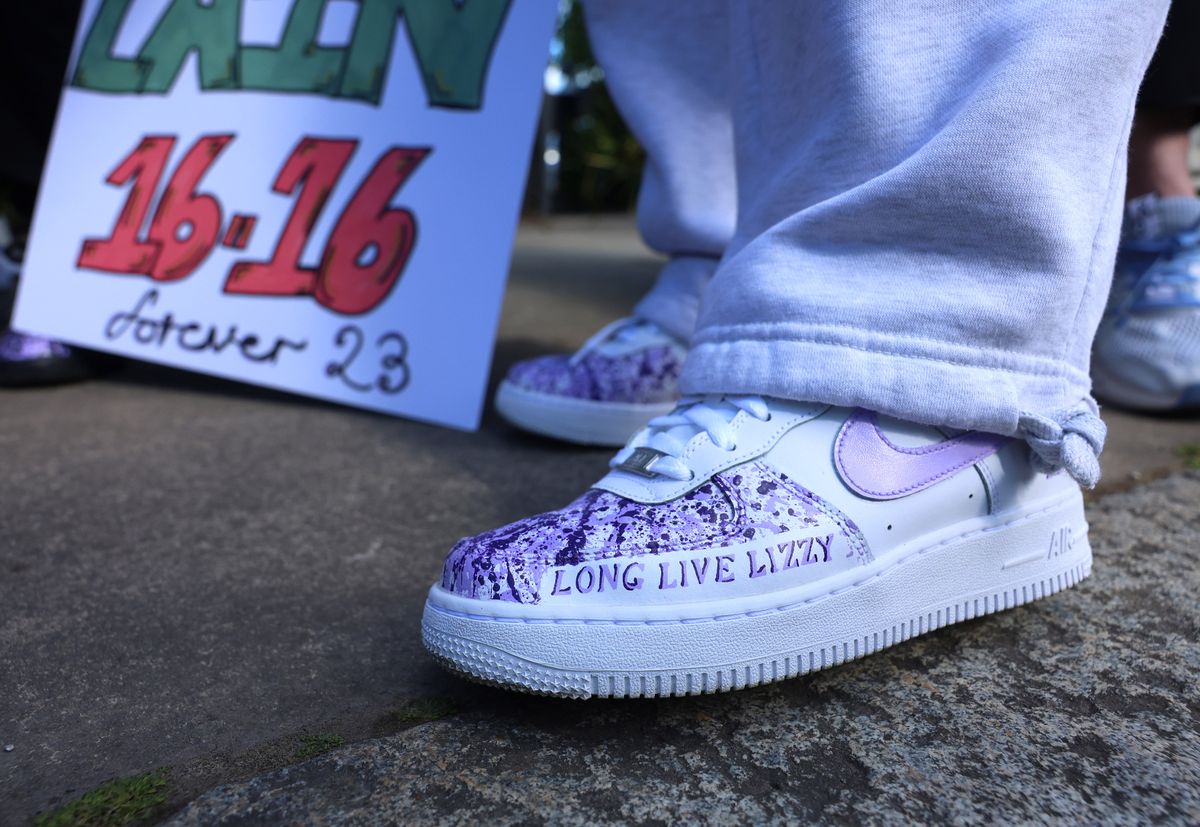 Customised Nike Air Force Ones worn during the march